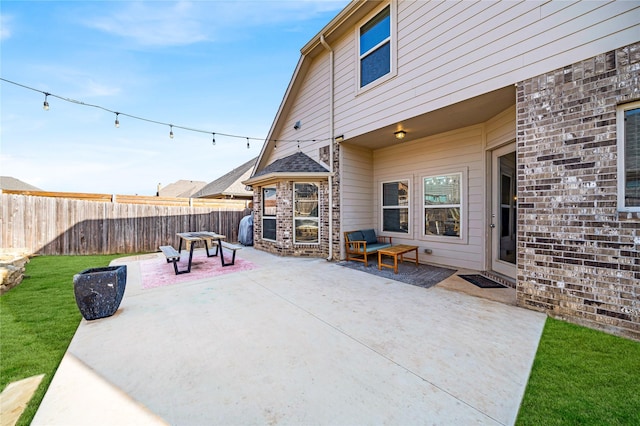 view of patio featuring fence