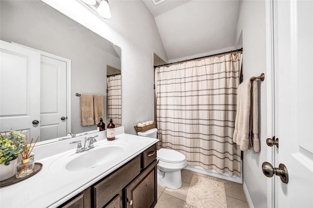 bathroom featuring toilet, lofted ceiling, tile patterned floors, curtained shower, and vanity