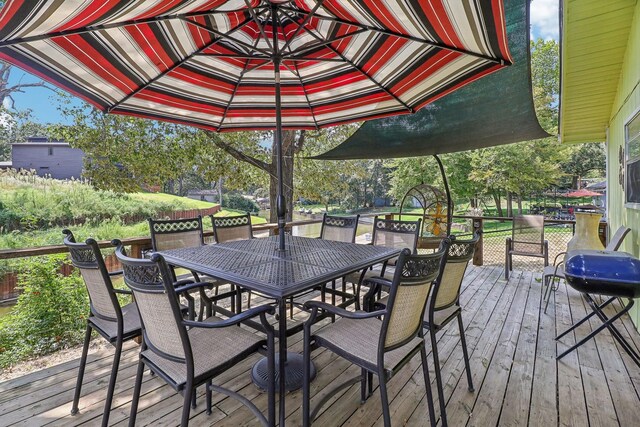 deck featuring outdoor dining area