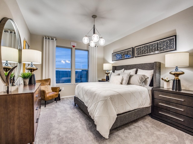 carpeted bedroom with baseboards and a notable chandelier