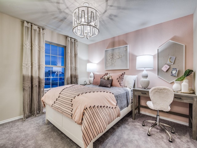 carpeted bedroom with a notable chandelier and baseboards