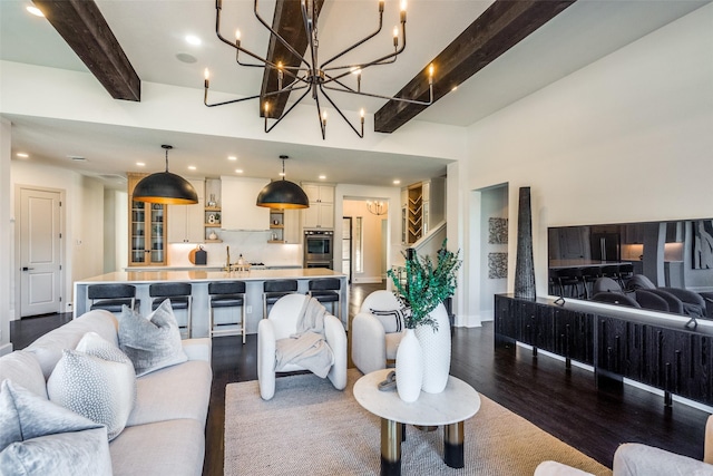 living area with recessed lighting, beam ceiling, baseboards, and wood finished floors