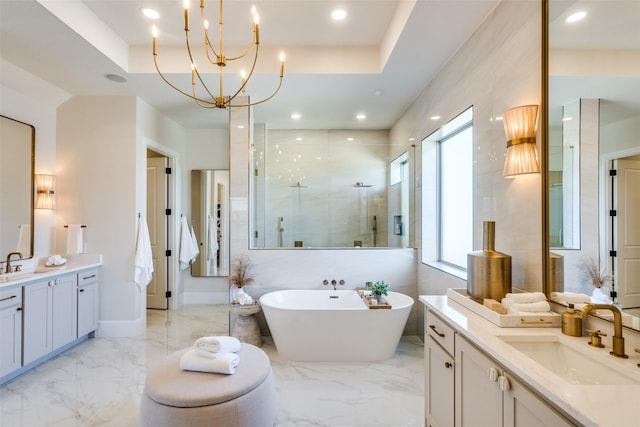 bathroom with marble finish floor, two vanities, a sink, and a shower stall