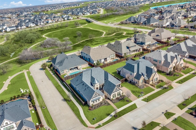 bird's eye view with view of golf course and a residential view