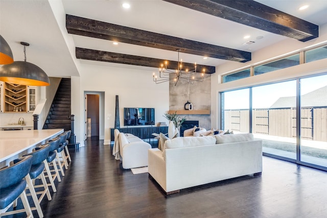 living room featuring dark wood-style floors, stairs, beamed ceiling, and an inviting chandelier