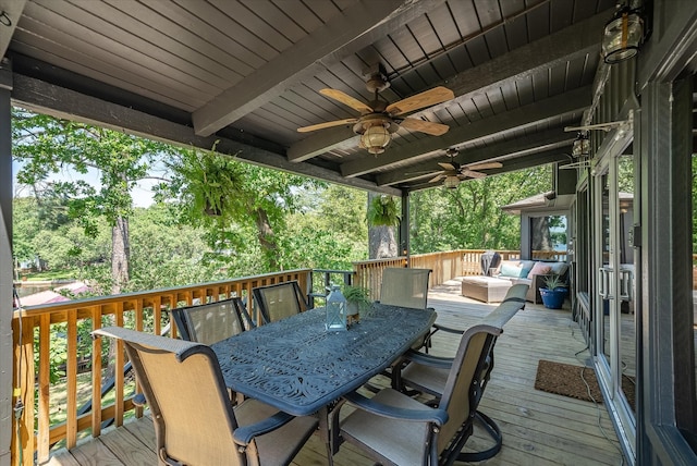 deck with ceiling fan and outdoor dining area