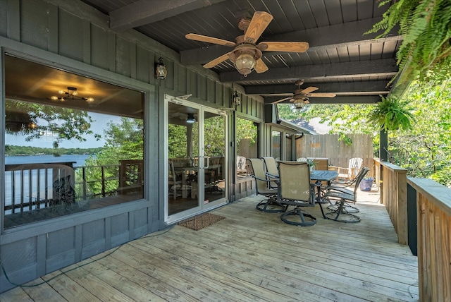 deck featuring outdoor dining area and ceiling fan