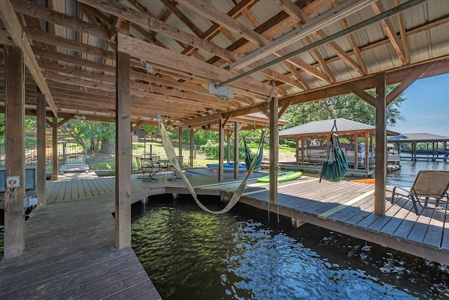 dock area featuring a water view and boat lift