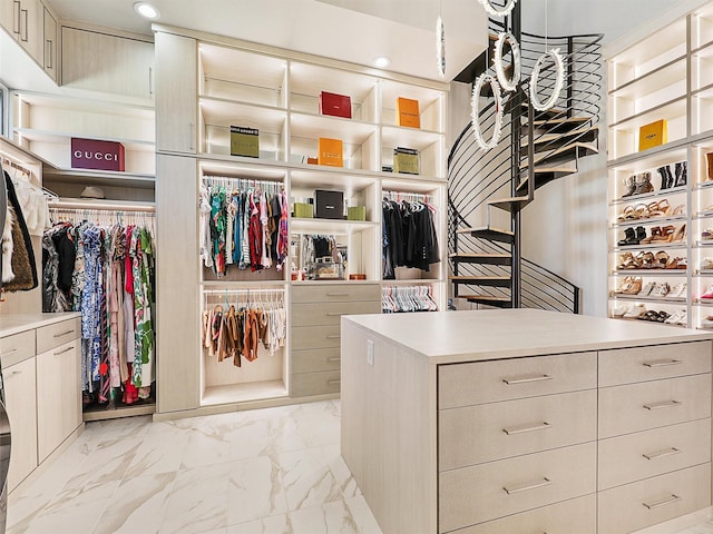 spacious closet featuring marble finish floor