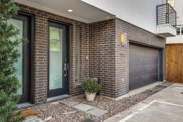 property entrance featuring brick siding