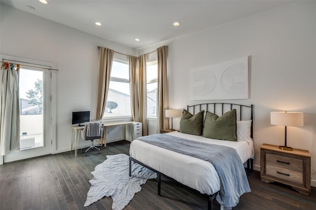 bedroom featuring access to exterior, recessed lighting, baseboards, and wood finished floors