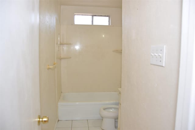 bathroom with shower / bathtub combination, tile patterned flooring, and toilet