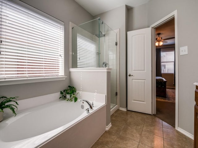 ensuite bathroom featuring a ceiling fan, a stall shower, tile patterned floors, a bath, and connected bathroom