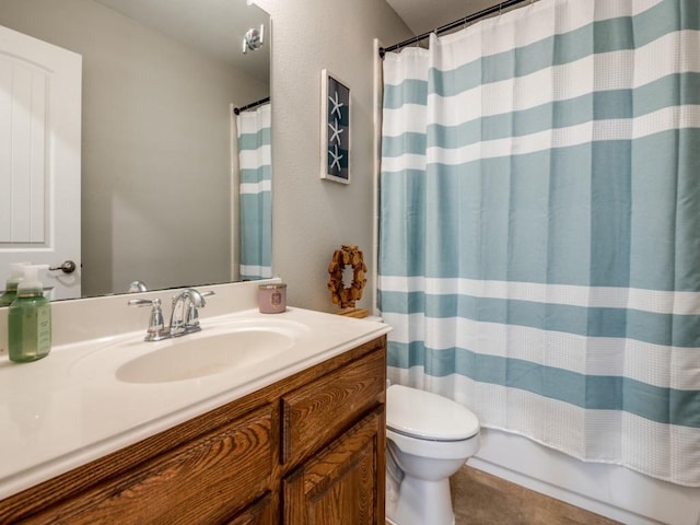 bathroom with tile patterned floors, toilet, and vanity