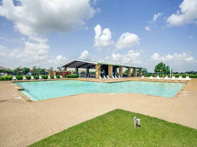 pool with a gazebo, a patio area, and fence