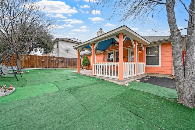 exterior space with a patio, fence private yard, and ceiling fan