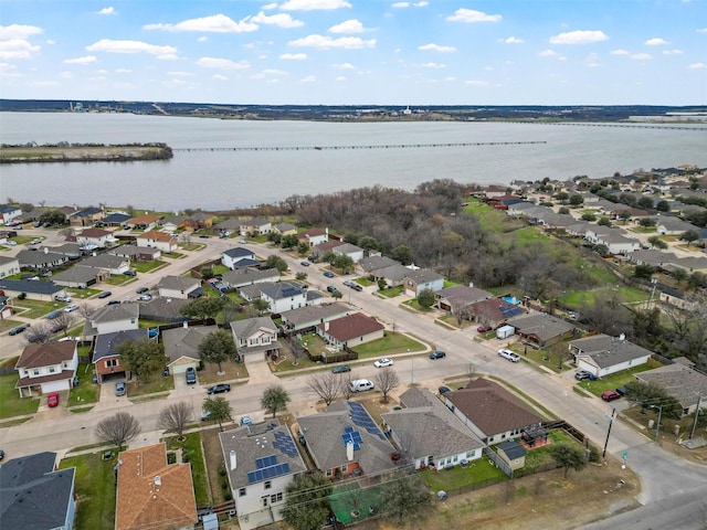 birds eye view of property featuring a residential view and a water view