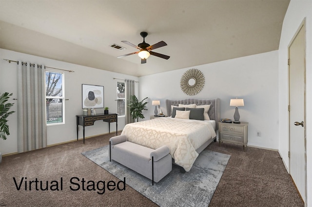 carpeted bedroom with visible vents and ceiling fan