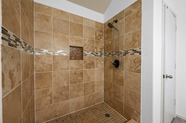 bathroom with tiled shower