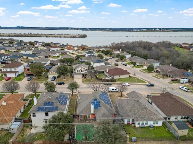 birds eye view of property with a residential view and a water view