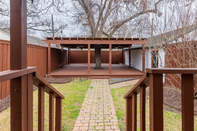 view of yard featuring a fenced backyard and a wooden deck