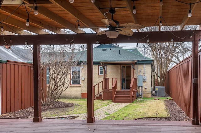 wooden deck with a ceiling fan, central AC, and fence