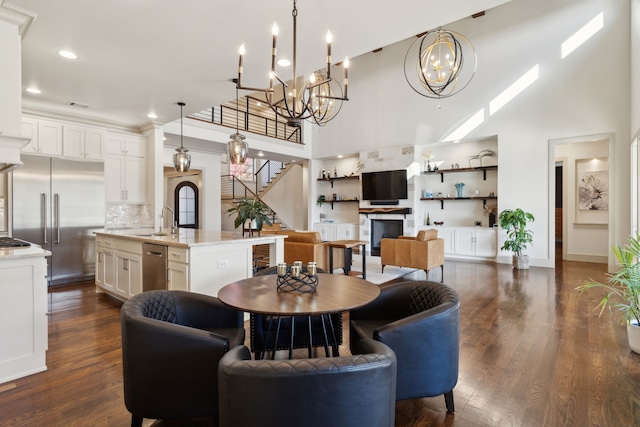 dining space featuring dark wood-style floors, stairway, recessed lighting, and baseboards