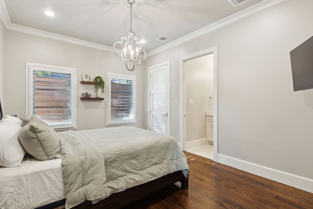 bedroom with a chandelier, ensuite bathroom, wood finished floors, baseboards, and ornamental molding