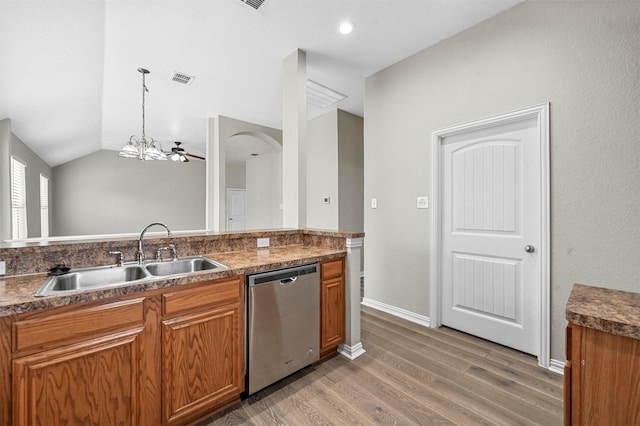 kitchen featuring a sink, dark countertops, brown cabinetry, and stainless steel dishwasher