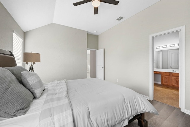 bedroom featuring lofted ceiling, visible vents, a ceiling fan, built in study area, and wood finished floors