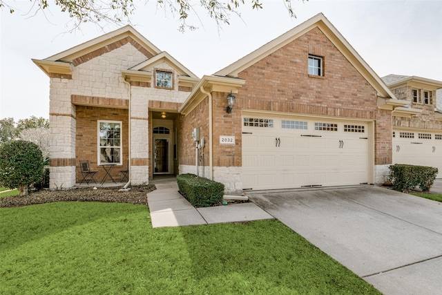 view of front of property with stone siding, brick siding, an attached garage, and driveway