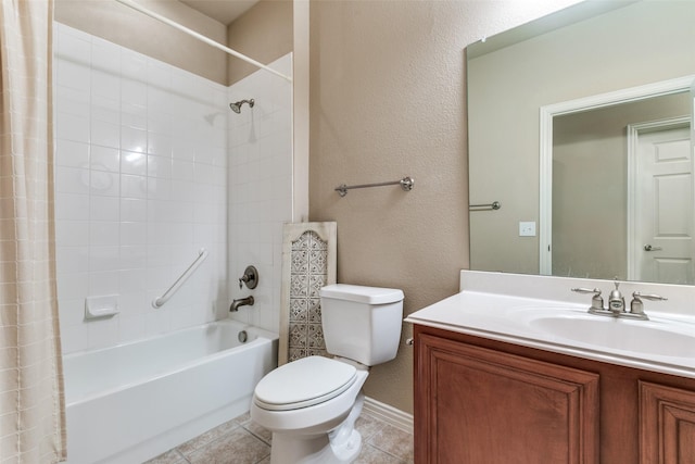 bathroom with a textured wall, toilet, vanity, tile patterned floors, and shower / bath combo with shower curtain