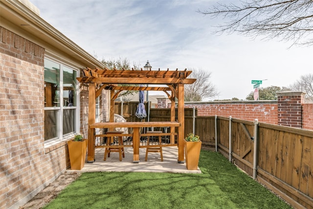 view of yard with fence, a pergola, and a patio