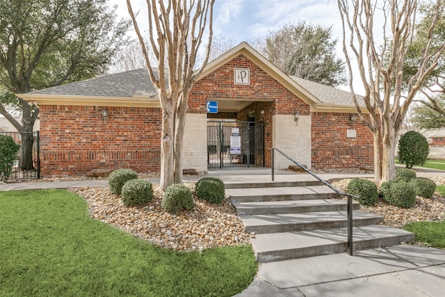 single story home with brick siding and roof with shingles