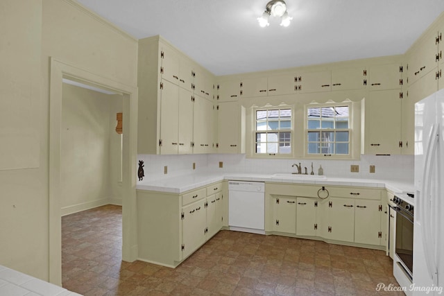 kitchen with a sink, tile countertops, white appliances, and backsplash