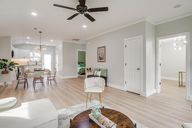 living room featuring recessed lighting, light wood-style floors, ornamental molding, baseboards, and ceiling fan with notable chandelier