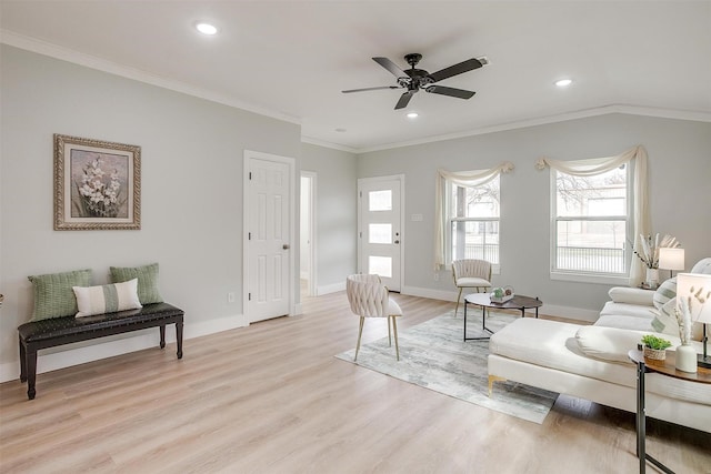 living area with light wood finished floors, ornamental molding, recessed lighting, and baseboards