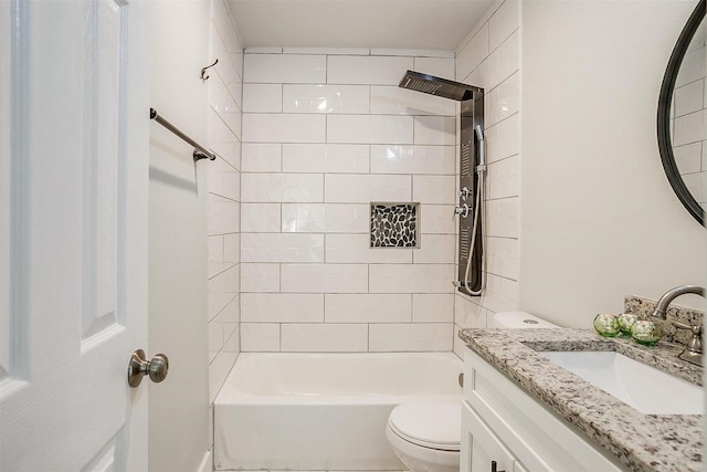 bathroom featuring shower / washtub combination, vanity, and toilet