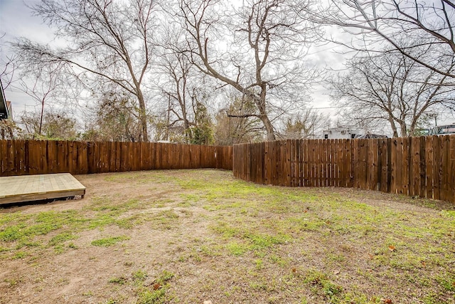 view of yard with a fenced backyard