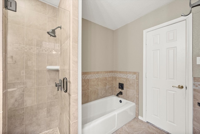 full bathroom featuring a stall shower and a bath