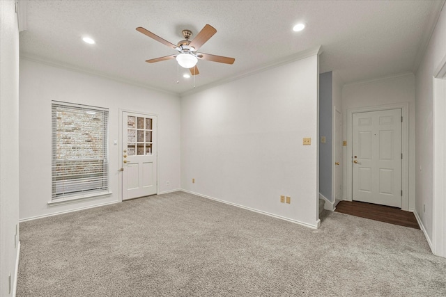 unfurnished room with carpet, crown molding, and recessed lighting