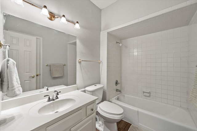 full bath featuring shower / washtub combination, vanity, toilet, and wood finished floors