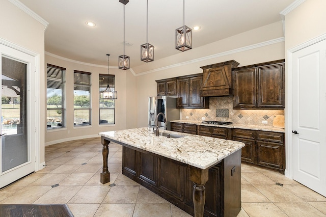 kitchen featuring ornamental molding, stainless steel fridge with ice dispenser, backsplash, and gas cooktop