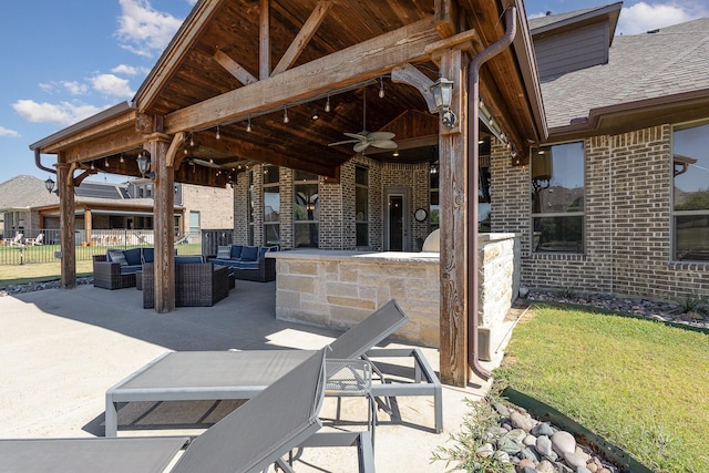 view of patio / terrace featuring an outdoor hangout area, fence, and a ceiling fan