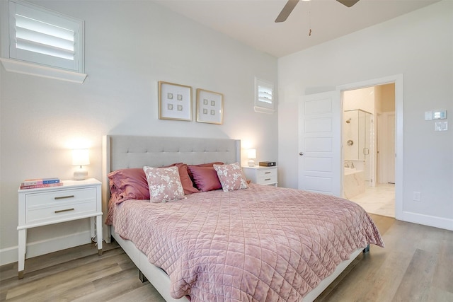 bedroom with a ceiling fan, ensuite bath, light wood-style flooring, and baseboards