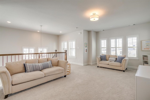 living room featuring light carpet, baseboards, visible vents, and recessed lighting