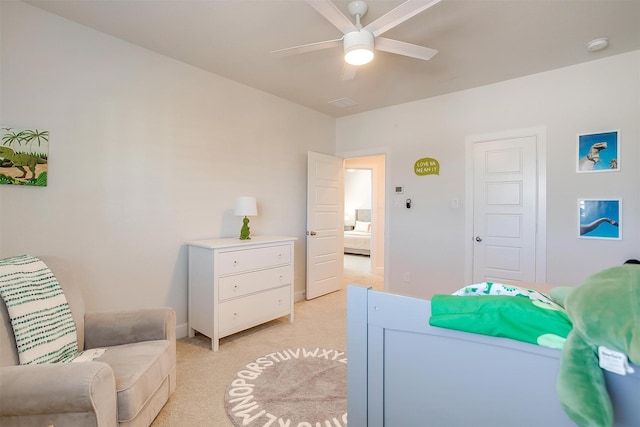 bedroom featuring light carpet and ceiling fan