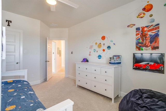 bedroom with light carpet, ceiling fan, and baseboards