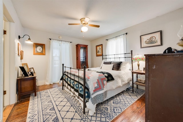 bedroom featuring light wood-style floors and a ceiling fan