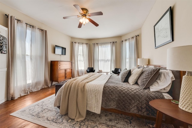 bedroom featuring a ceiling fan and wood finished floors